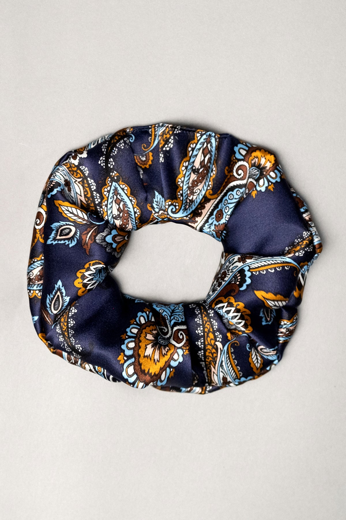 Lullaby silk scrunchie – deep navy, paisley pattern